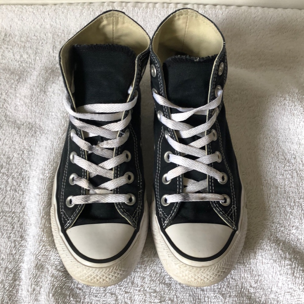 Black high top converse, size 8 in women’s.